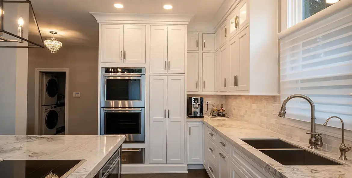 Kitchen view of sink, island, and oven